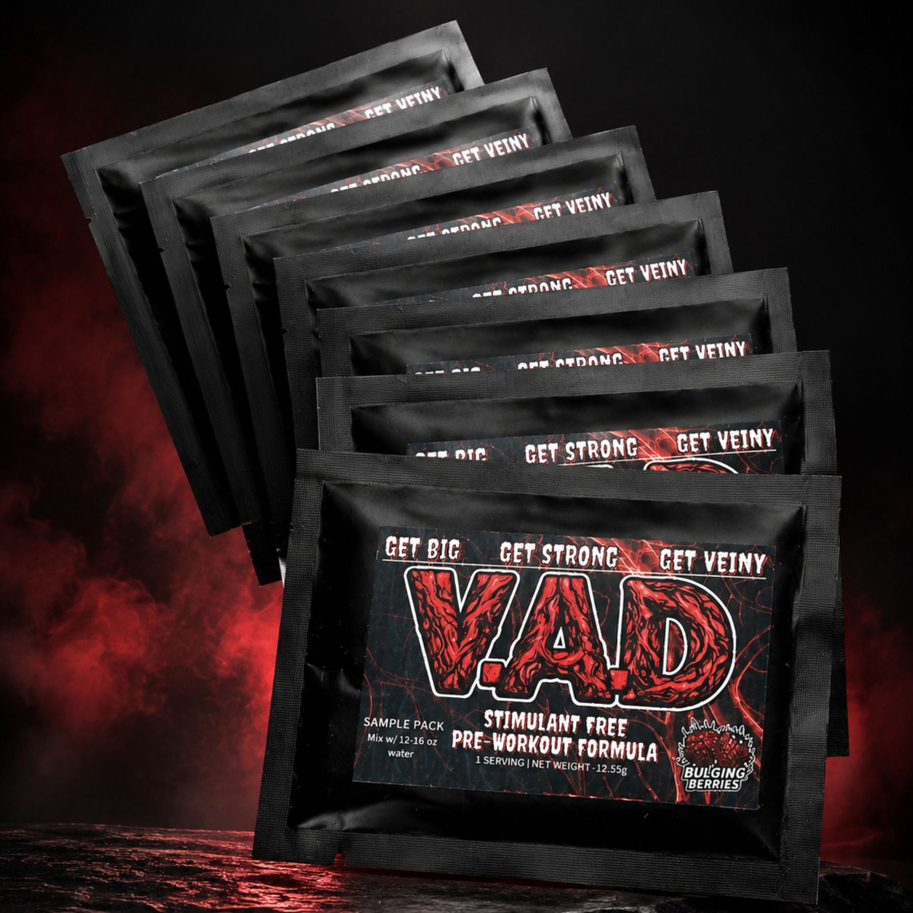 A set of black VAD pre-workout supplement to-go packets fanned out against a dark, smoky background with red lighting. The front packet features a bold red and black 'VAD' logo with the text 'GET BIG GET STRONG GET VEINY' and 'STIMULANT FREE PRE-WORKOUT FORMULA'.