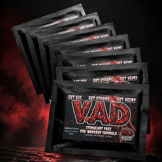 A set of black VAD pre-workout supplement to-go packets fanned out against a dark, smoky background with red lighting. The front packet features a bold red and black 'VAD' logo with the text 'GET BIG GET STRONG GET VEINY' and 'STIMULANT FREE PRE-WORKOUT FORMULA'.