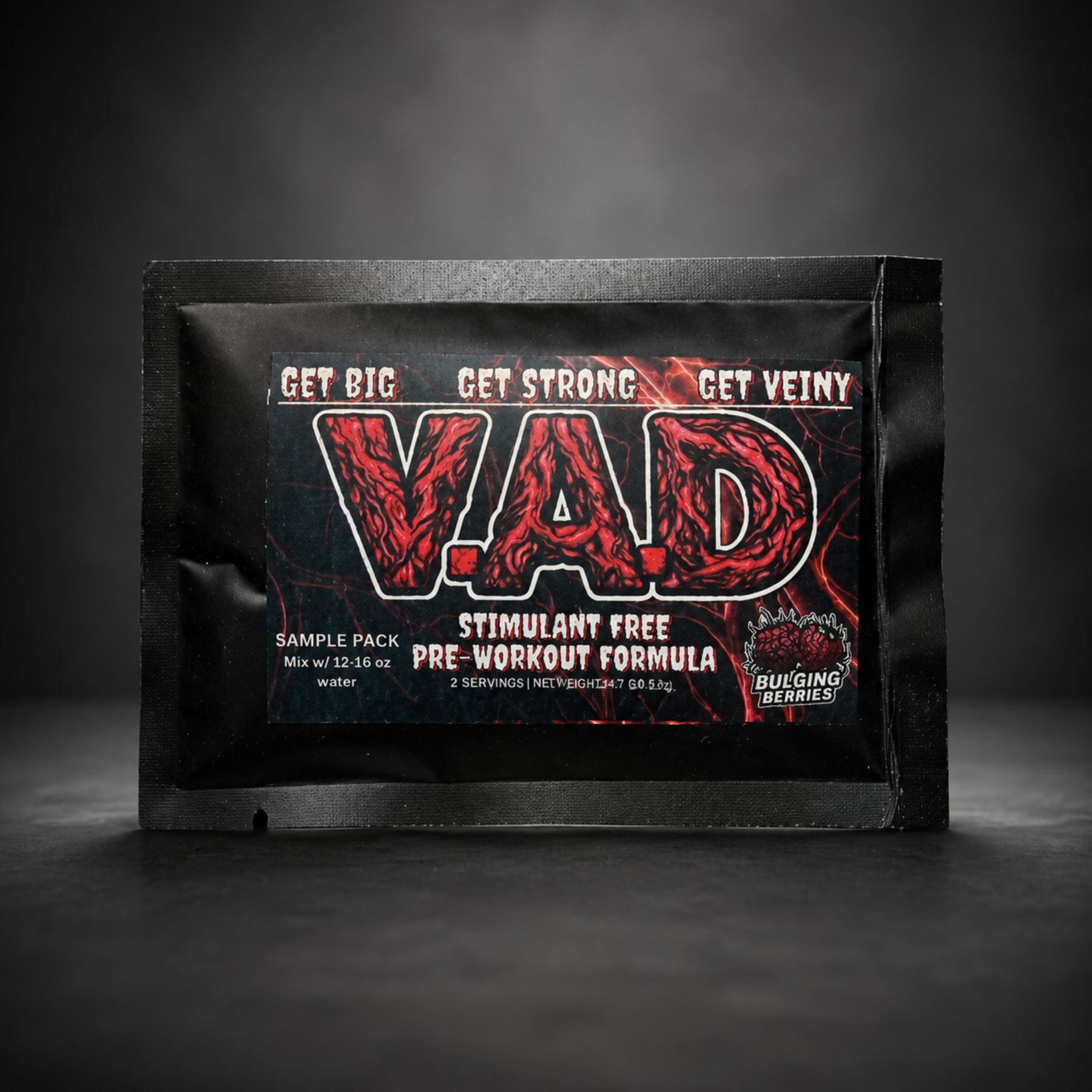A black sample pack pouch for VAD Stimulant Free Pre-Workout Formula, featuring a bold red and black label with the brand name 'VAD' and 'Bulging Berries' logo, set against a dark studio background.